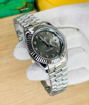 Rolex silver chain with black dial and date just