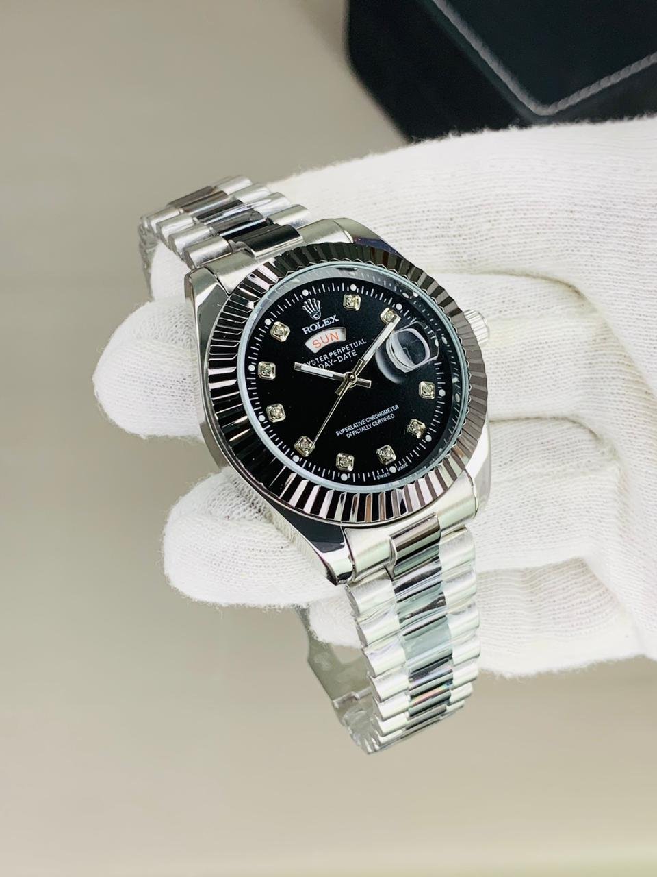 Rolex fluted bazel black silver chain with black dial and date day funtion