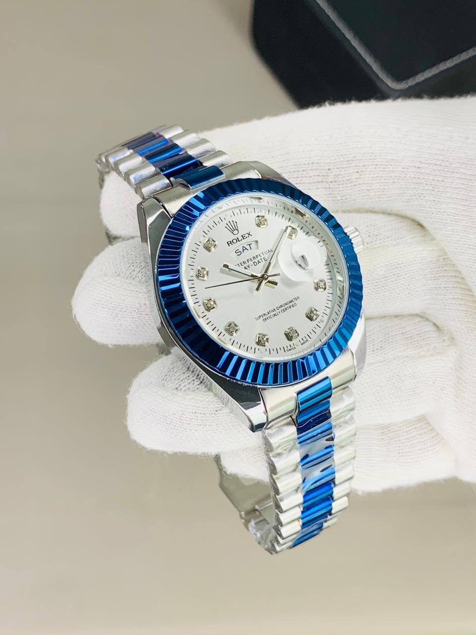 Rolex fluted bazel blue silver chain with white dial and date day function