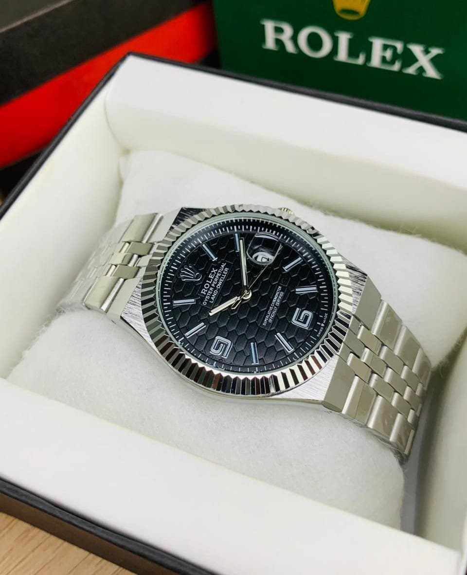 Rolex Land Deweller silver chain and black with date function